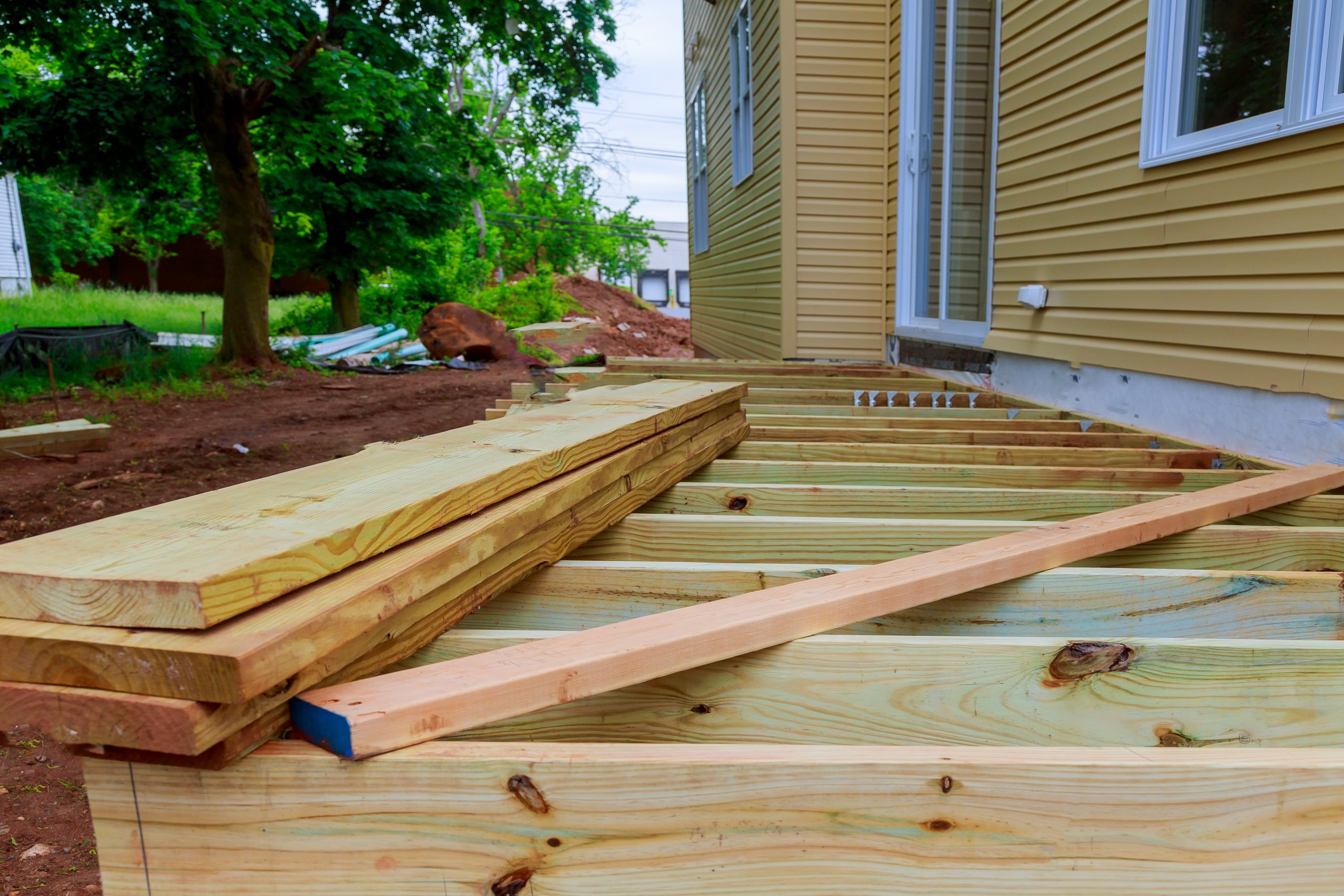 A installation wooden deck or patio new home, timber deck being constructed